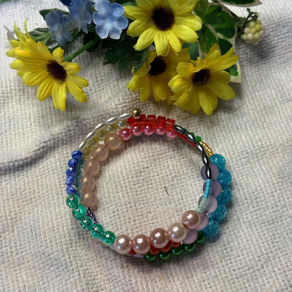Handmade Red and Pink Beaded Bracelet with Translucent Charm